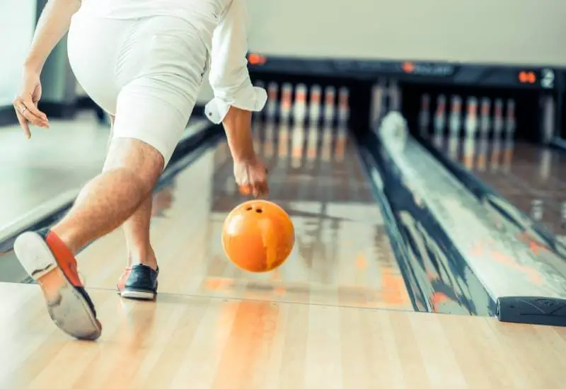 A man Throwing a bowling ball